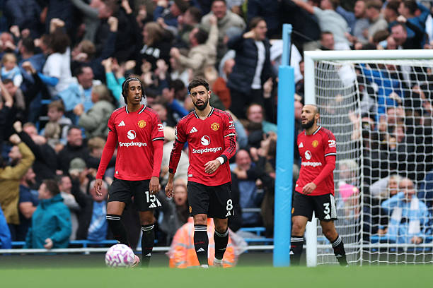 Bruno Fernandes and Leny Yoro react to Phil Foden's goal.