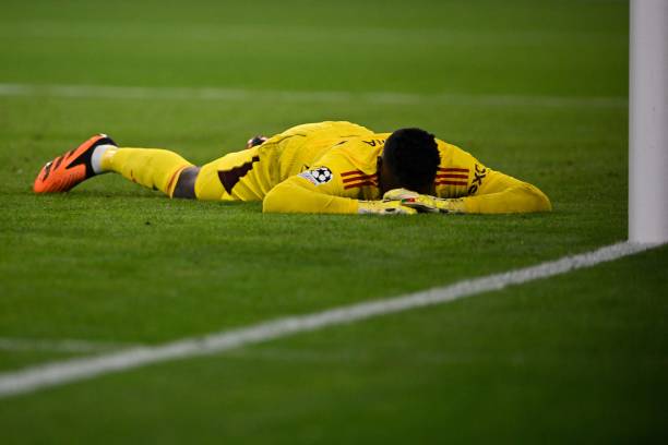 Andre Onana, face down on the floor after Manchester United go 1-0 down at the Allianz Arena.