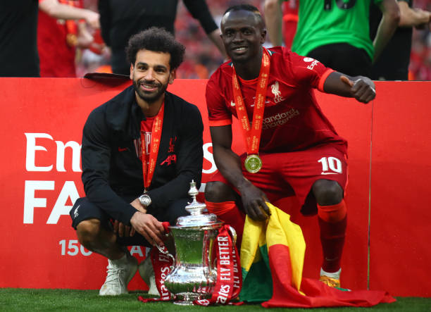 Sadio Mane and Mo Salah with the FA Cup trophy