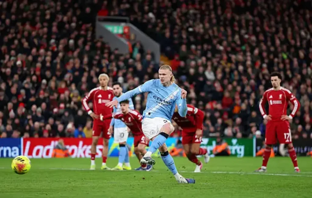 Erling Haaland of Manchester City scores his team's second goal from the penalty spot during the Premier League match between Liverpool and Manchester City at Anfield 