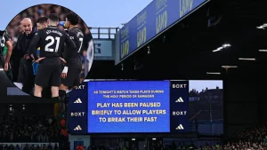 Message on screen at Elland Road about play being paused for Muslim players to break fast with overlay of