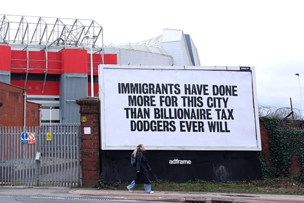 The poster, installed by activist group Everyone Hates Elon, followed widely criticised comments by Manchester United co-owner Jim Ratcliffe who said the UK was "colonised by immigrants."